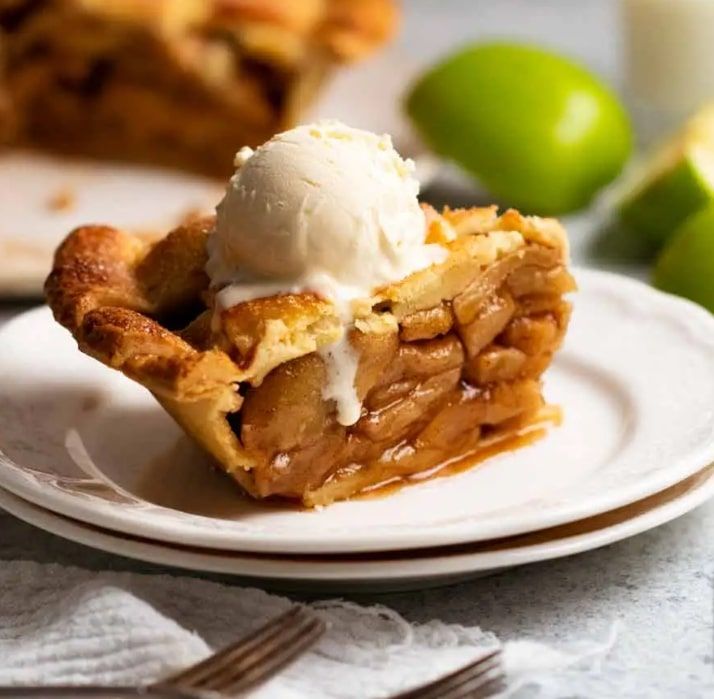 Apple pie slice with ice cream toppings