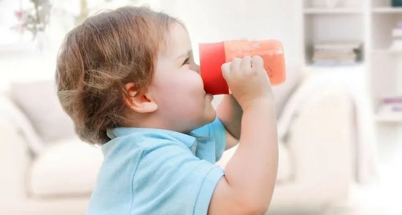 Baby drinking from cup