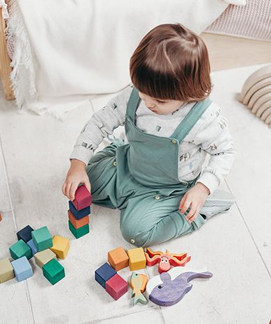 9 month old baby playing with toys