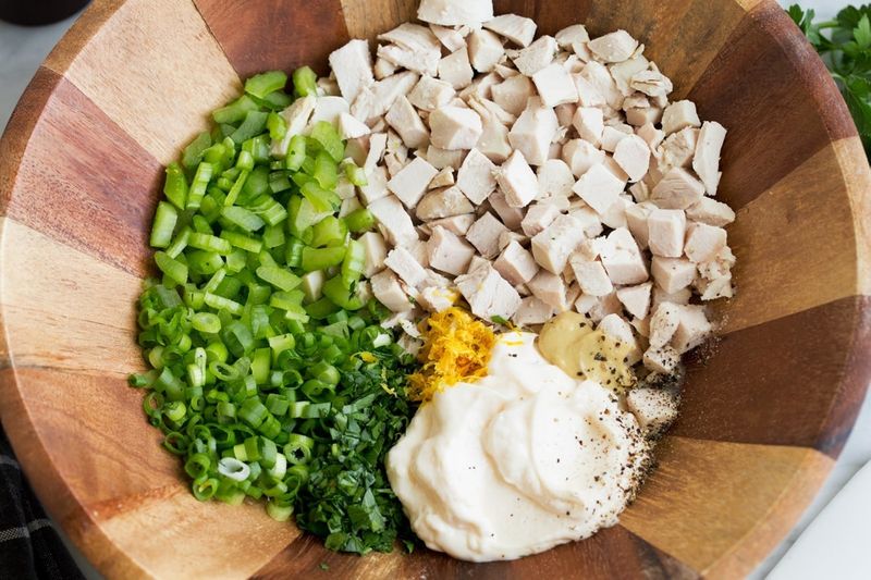 mixing ingredients for chicken salad