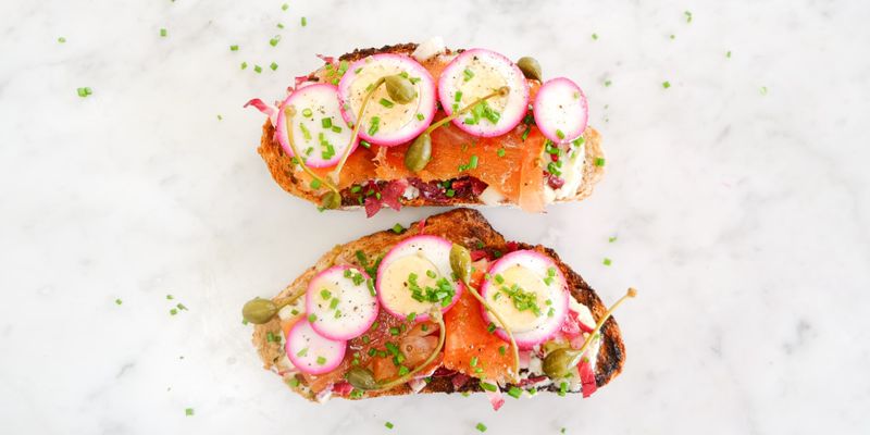 Tartines with smoked salmon, egg, and capers